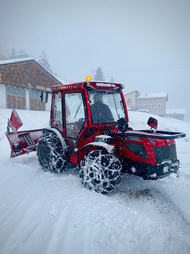 Snow cleanup during heavy snowfall.